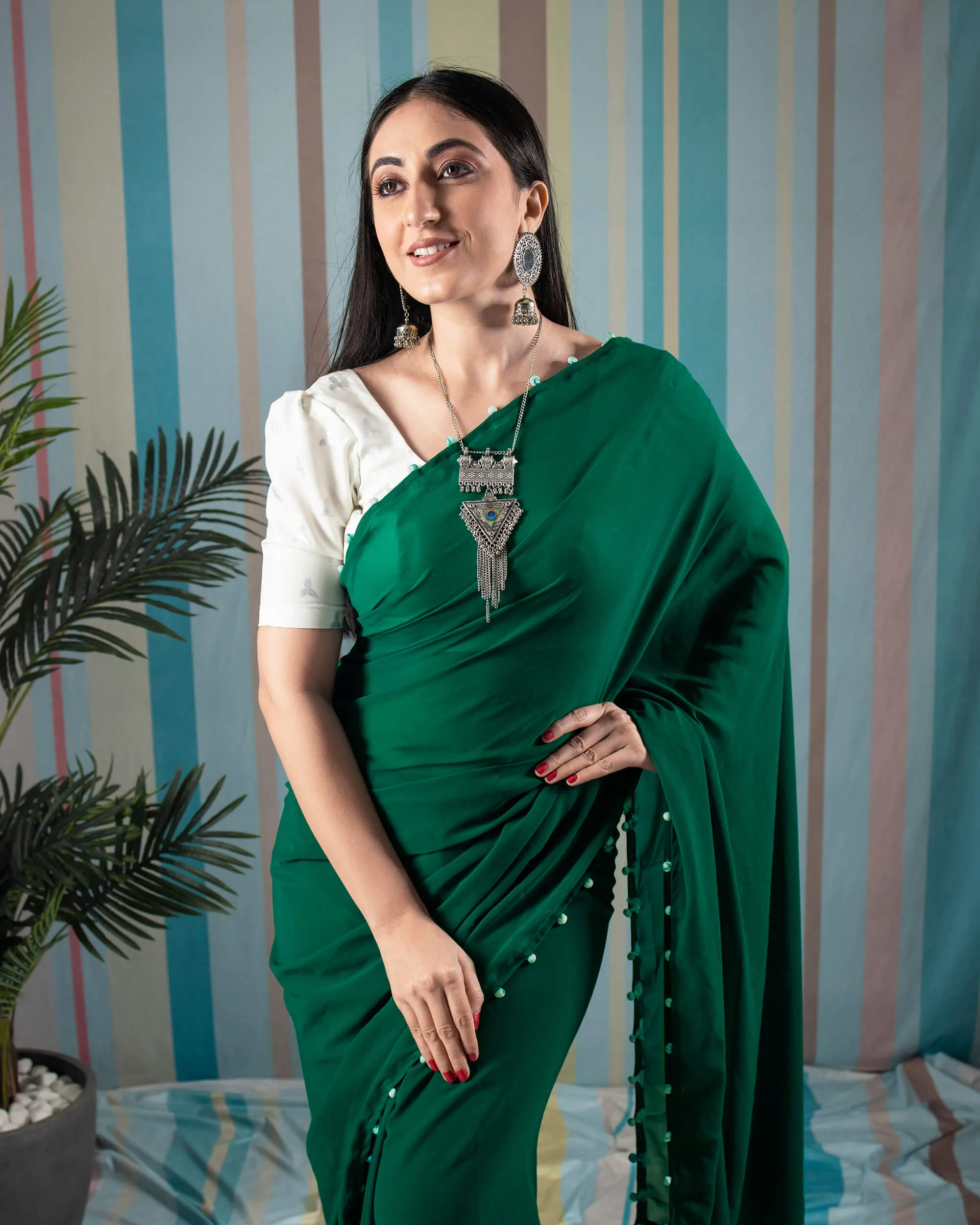 Grass Green Plain Georgette Saree With Potli Tassles