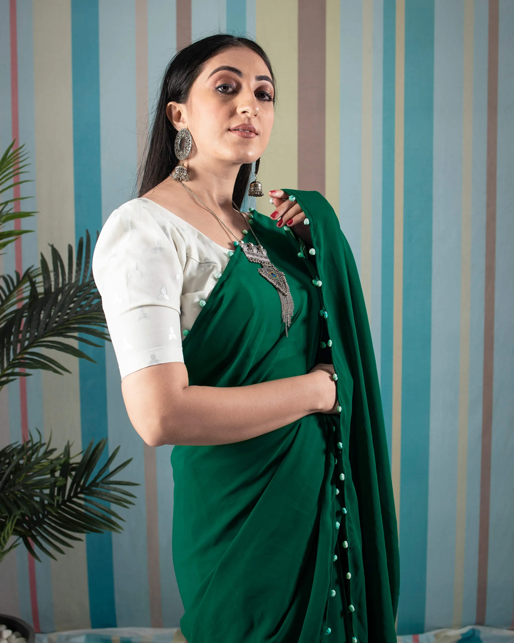 Grass Green Plain Georgette Saree With Potli Tassles